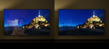 תמונות של עיירה על ראש גבעה בלילה במסכי טלוויזיה נפרדים, כדי להראות את התועלת שב-X-Anti Reflection.