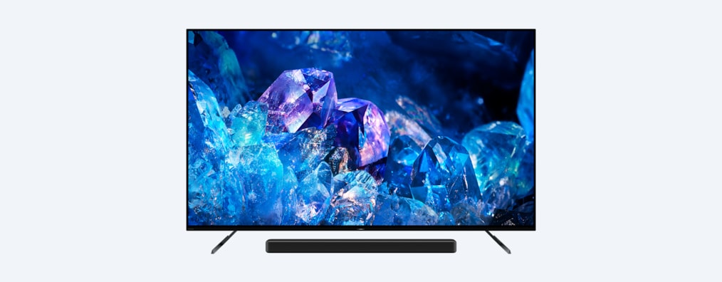 צילום צד קדמי של BRAVIA A80K על מעמד טלוויזיה עם מקרן קול, ותמונה של קריסטלים בצבעי כחול וסגול על המסך