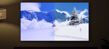 תמונה של מסך עם נוף הרים בחורף שמציגה את היתרונות של חיישן אור וצבע