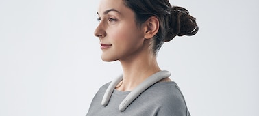 Woman wearing SRS-NB10 Wireless Neckband Speaker in white