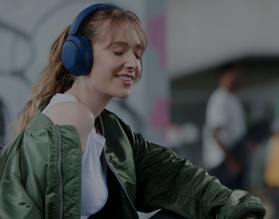 Image of a person enjoying music from a Sony Wireless Headphones
